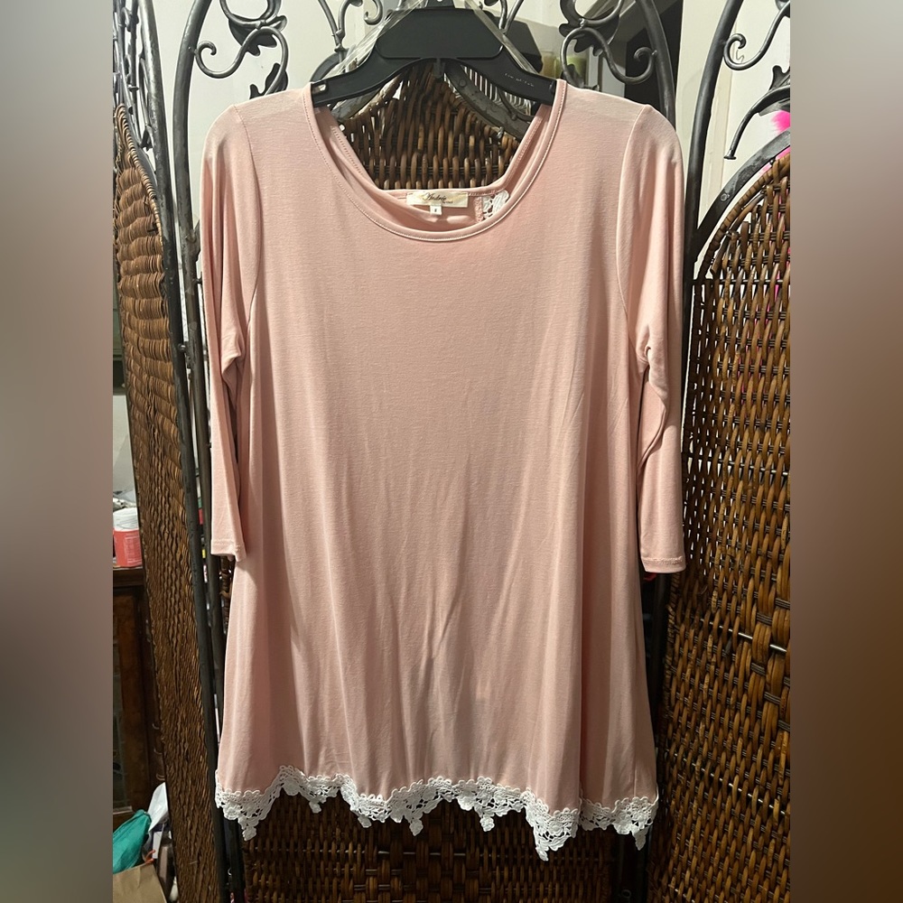 A peach pull over blouse  size small.